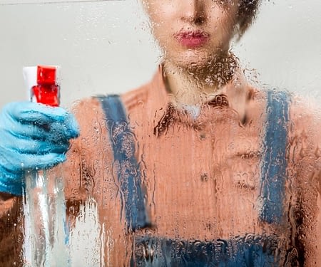 woman cleaning glass