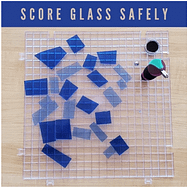 creators brand waffle grid glass cutting surface with cut pieces of blue glass on it