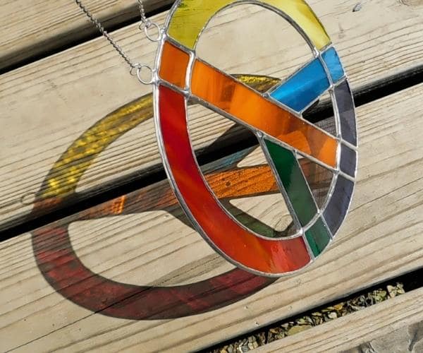 Rainbow Peace Sign Lead Free Stained Glass Reflecting in sun Mountain Woman Products