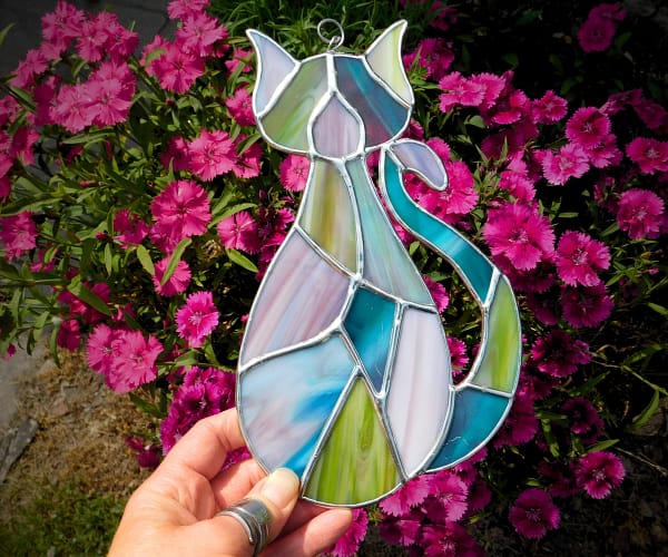 Stained glass patchwork cat suncatcher held in hand lead free Mountain Woman Products
