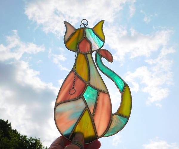 Stained glass patchwork cat lead free backlit by sky Mountain Woman Products