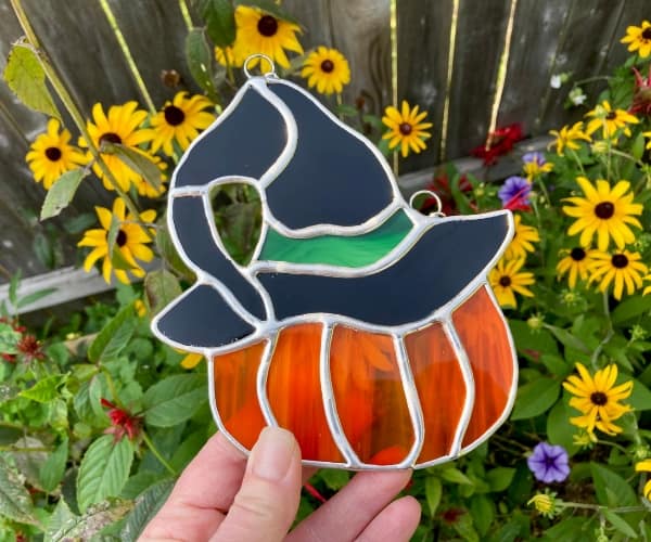 pumpkin with witch hat suncatcher lead free with rudbeckia mountain woman products